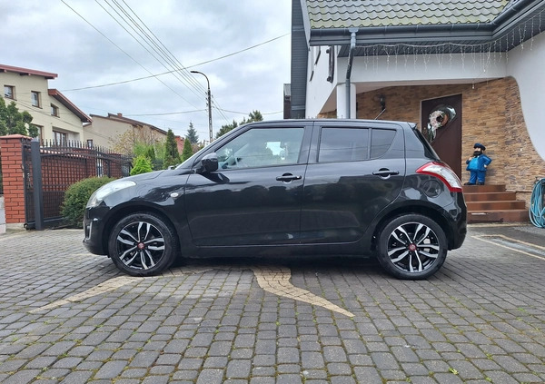 Suzuki Swift cena 34700 przebieg: 100200, rok produkcji 2015 z Żychlin małe 326